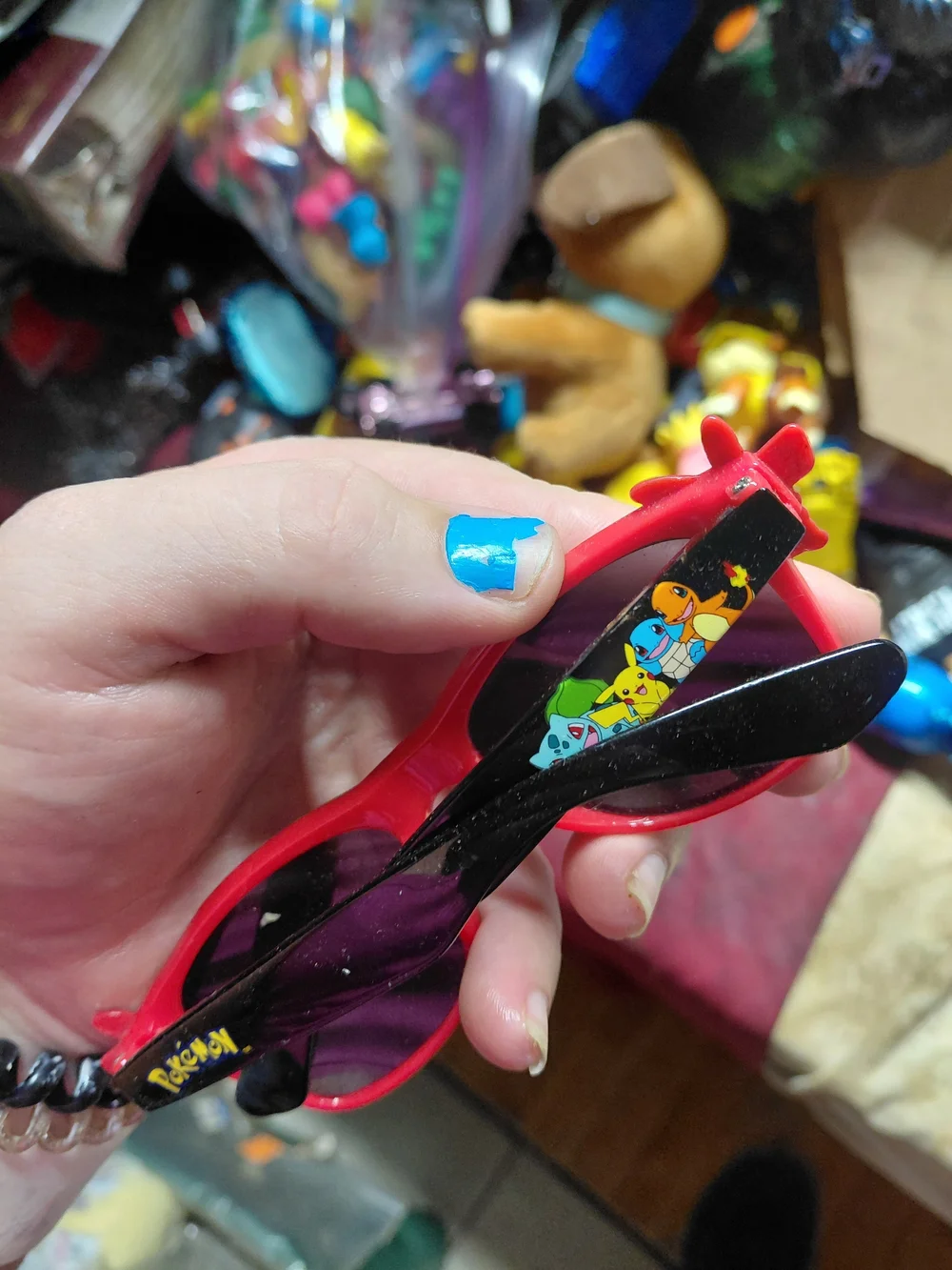 Nintendo Pokémon Pikachu sunglasses feature a red frame with a Poké Ball pattern